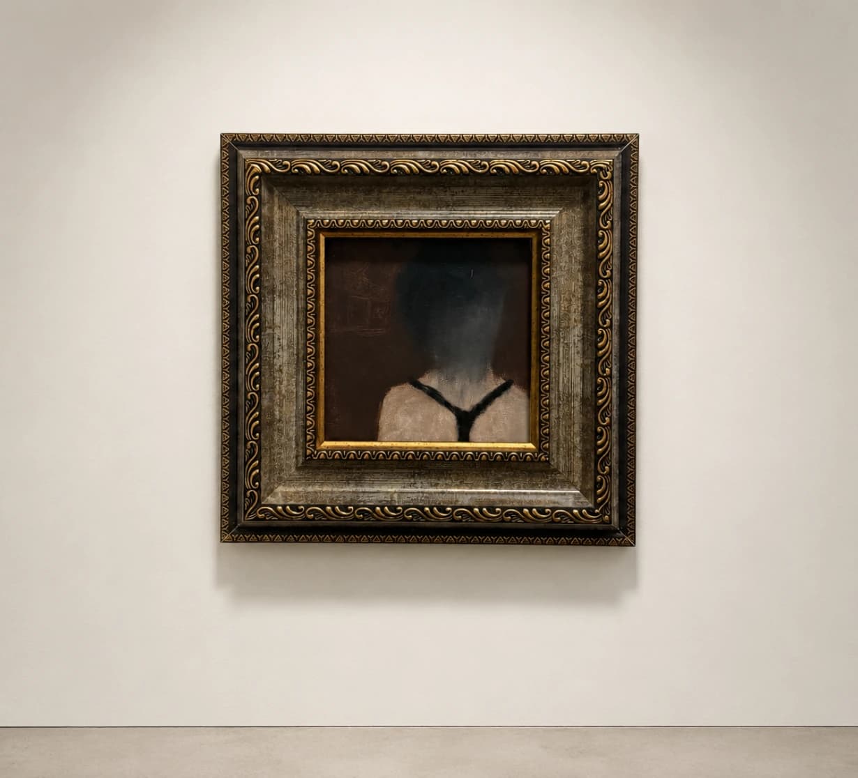 A small painting in an ornate dark and gold frame.