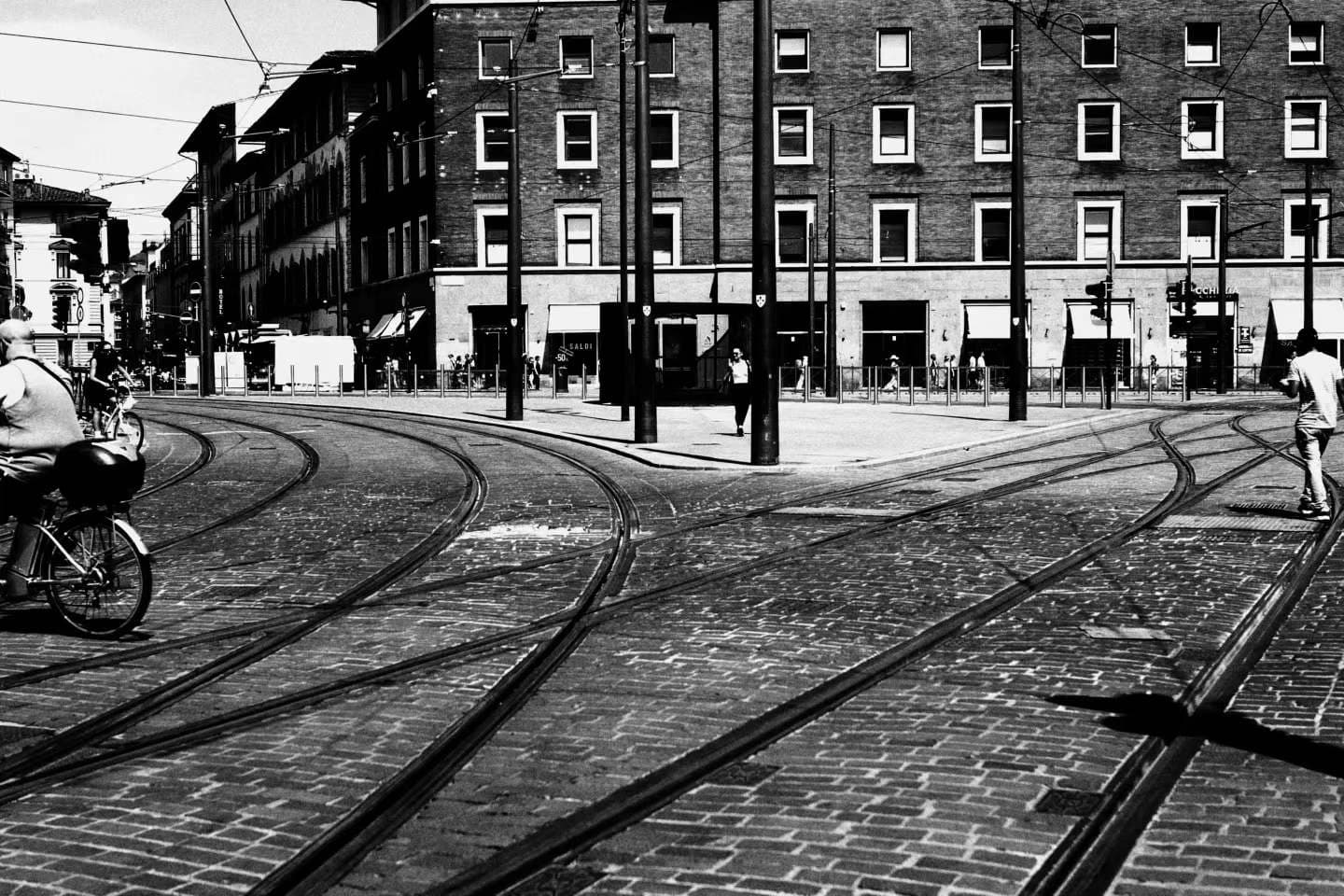 Tram tracks curving around a street corner.